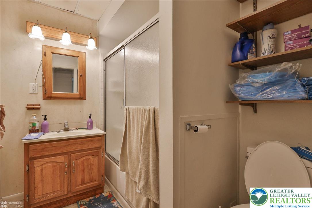 214 West Ridge Street Lansford, PA 18232 - Photo 21 of 52 a bathroom with a sink a toilet and shower