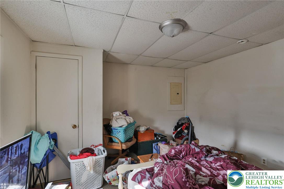 214 West Ridge Street Lansford, PA 18232 - Photo 29 of 52 a living room with furniture and a chandelier