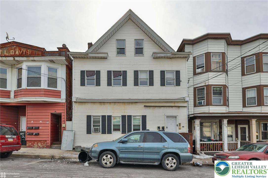 214 West Ridge Street Lansford, PA 18232 - Photo 3 of 52 a car parked in front of a building