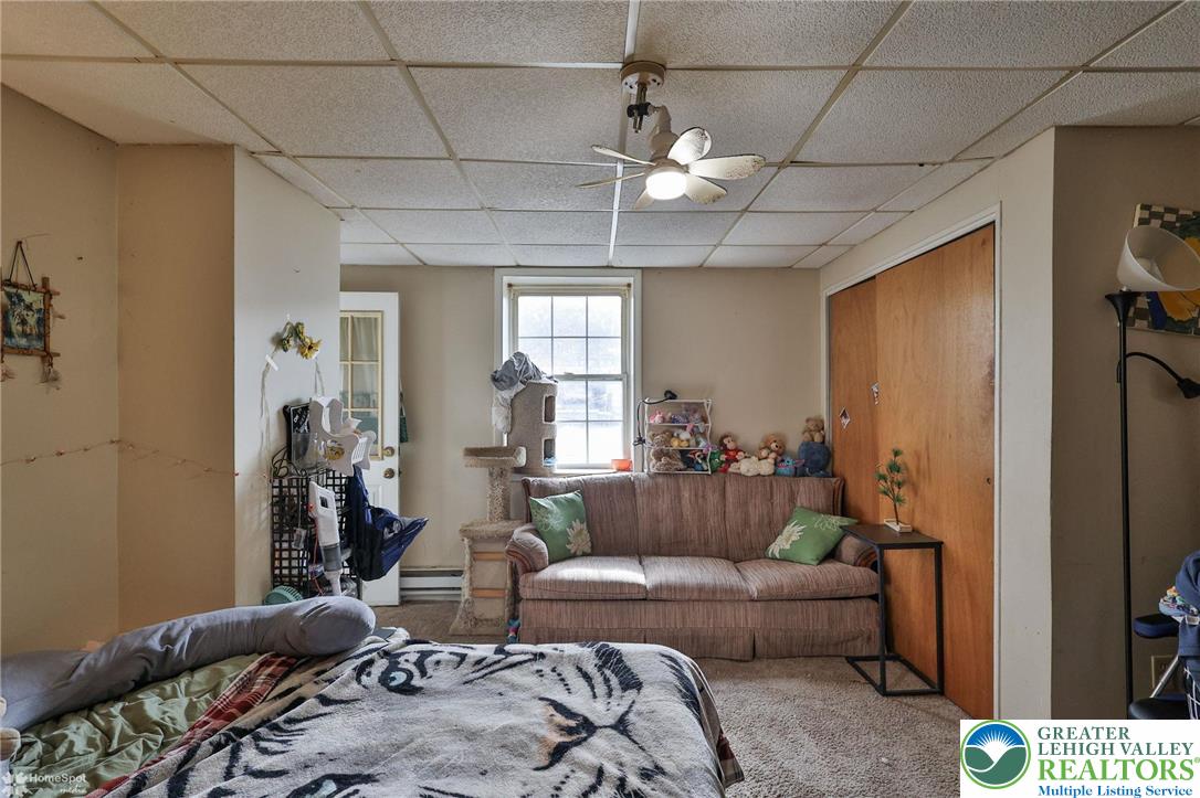 214 West Ridge Street Lansford, PA 18232 - Photo 32 of 52 a living room with furniture and a chandelier