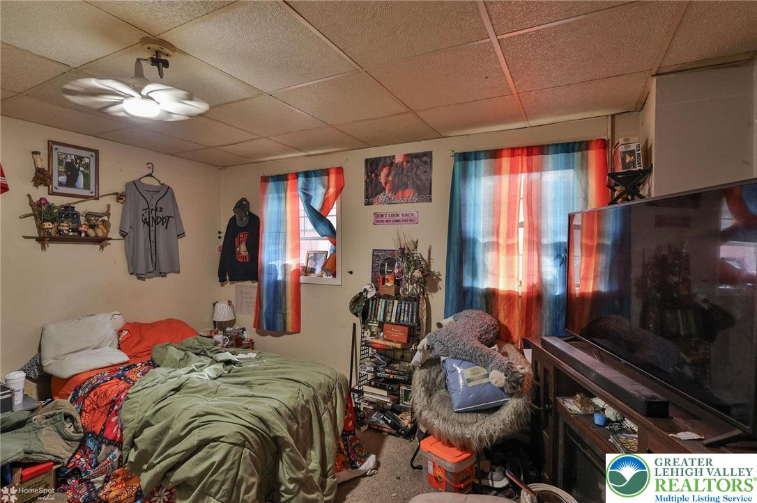 214 West Ridge Street Lansford, PA 18232 - Photo 36 of 52 a bedroom with furniture and a flat screen tv