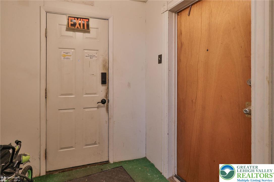 214 West Ridge Street Lansford, PA 18232 - Photo 4 of 52 a view of a hallway with wooden floor