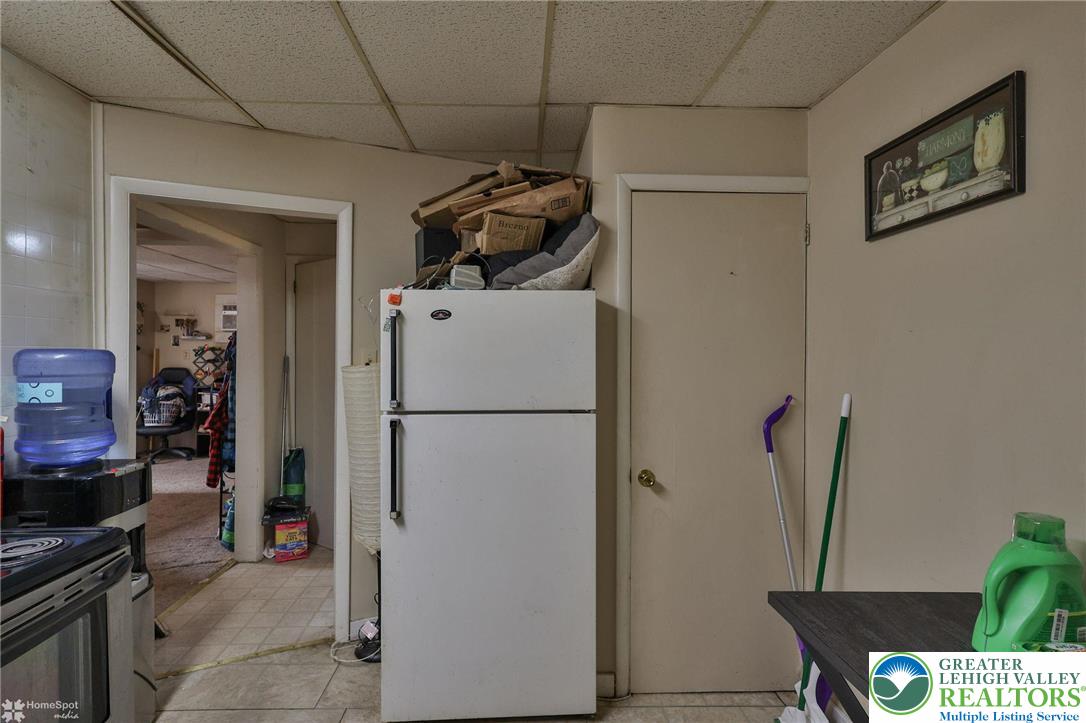 214 West Ridge Street Lansford, PA 18232 - Photo 47 of 52 a view of storage and utility room with refrigerator and washer