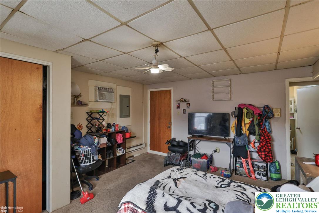 214 West Ridge Street Lansford, PA 18232 - Photo 48 of 52 a room with furniture and a flat screen tv