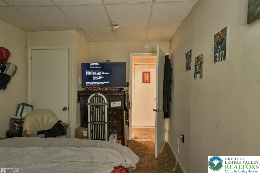 214 West Ridge Street Lansford, PA 18232 - Photo 49 of 52 a bedroom with a bed and a dresser