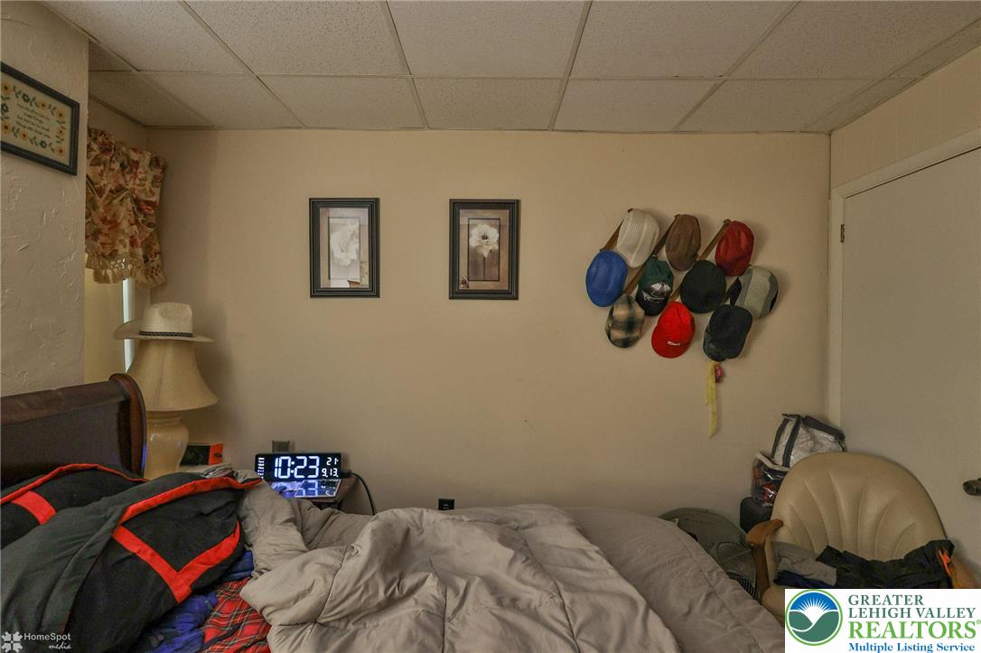 214 West Ridge Street Lansford, PA 18232 - Photo 50 of 52 a bedroom with a bed and a painting on the wall