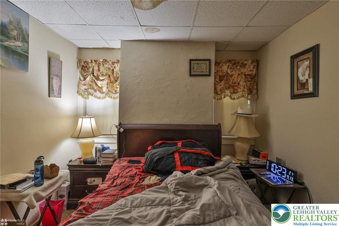 214 West Ridge Street Lansford, PA 18232 - Photo 9 of 52 a bedroom with a bed and a table