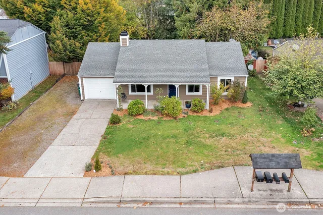 an aerial view of a house with a yard and garden