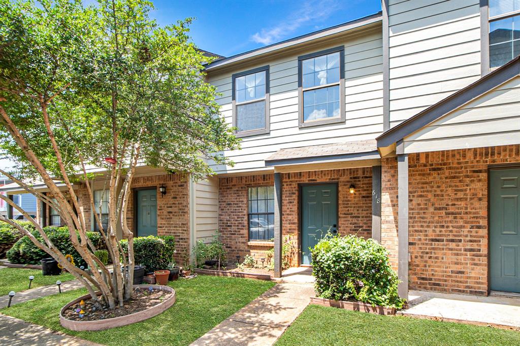 618 West Collins Street Denton, TX 76201 - Photo 23 of 25 a front view of a house with garden