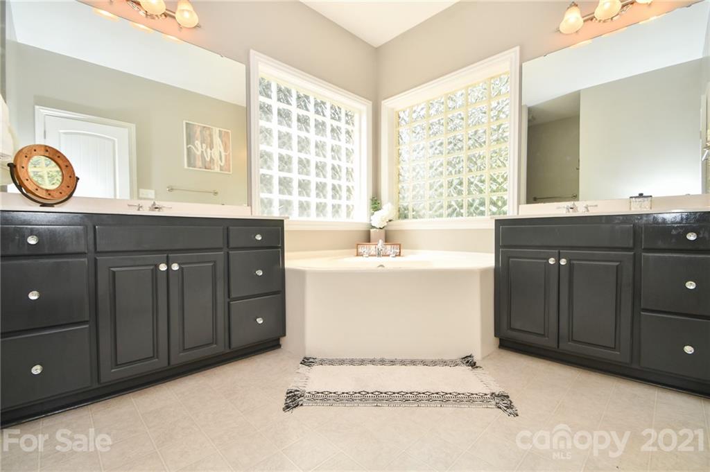 3600 Haigler Road Monroe, NC 28110 - Photo 22 of 30 a spacious bathroom with a sink double vanity and a mirror