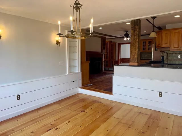 a view of room with window and hardwood floor