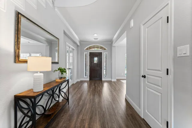 a view of a hallway and wooden floor an entryway