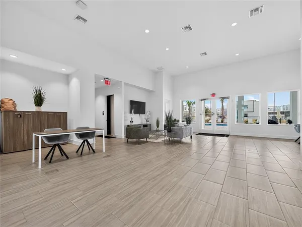a kitchen with stainless steel appliances a refrigerator and a sink