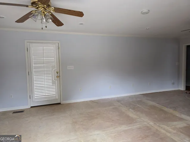 a view of a chandelier fan in a room