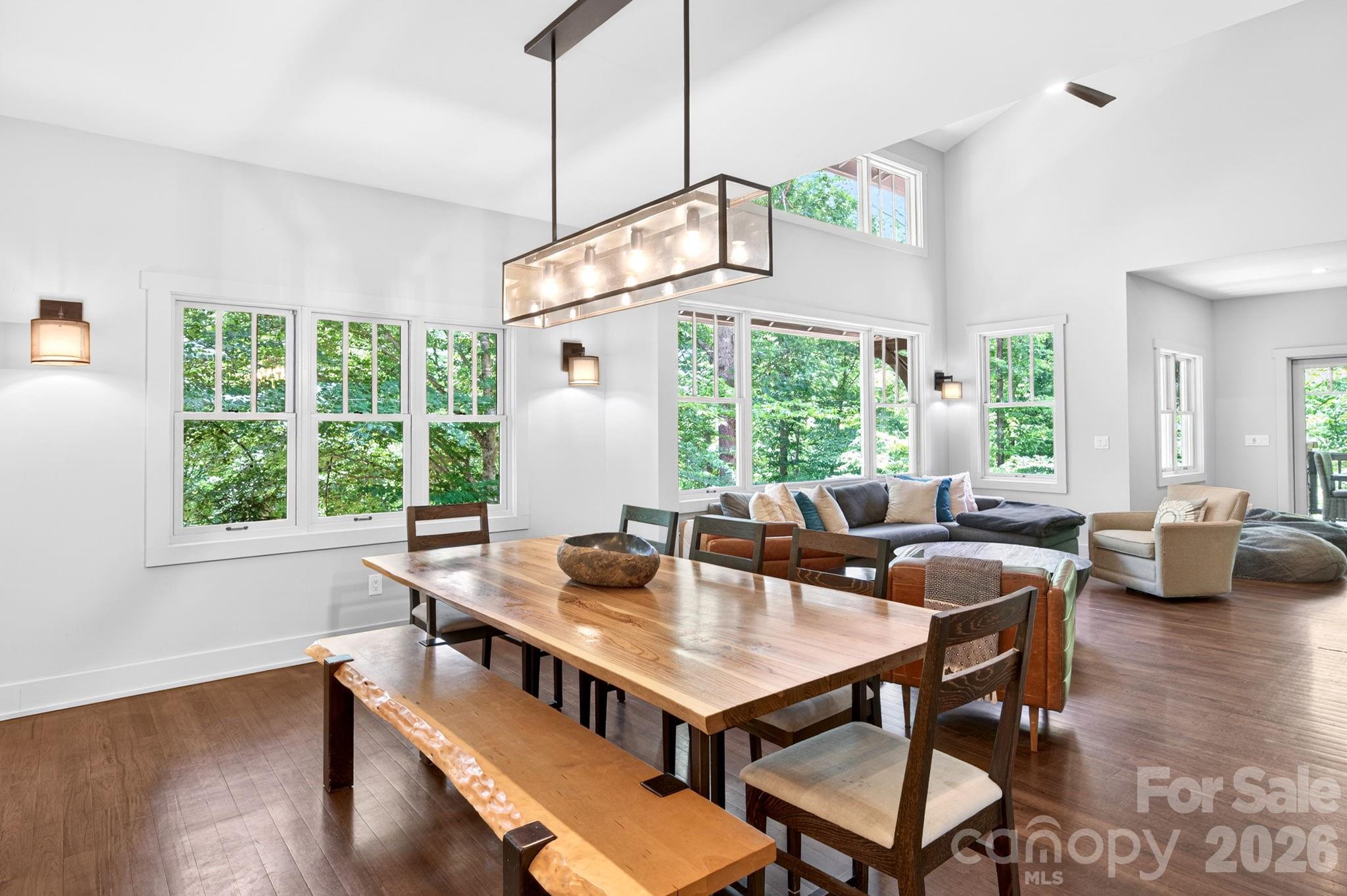 235 Bull Creek Road Asheville, NC 28805 - Photo 10 of 47 a view of a dining room with furniture window and outside view