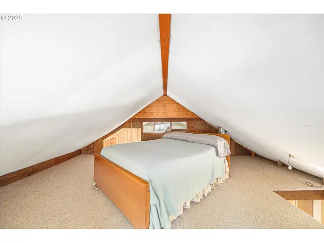 a living room with a bed