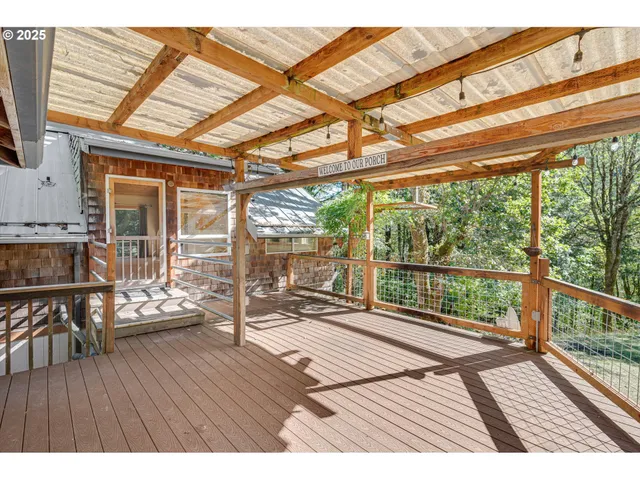 a view of house with a ocean from a ceiling window