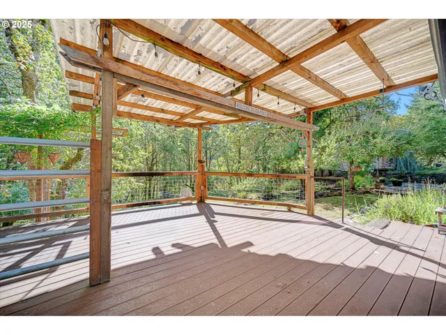 a view of an house with wooden floor and fence