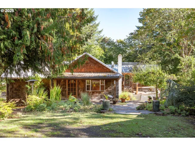 a front view of a house with a yard table and chairs