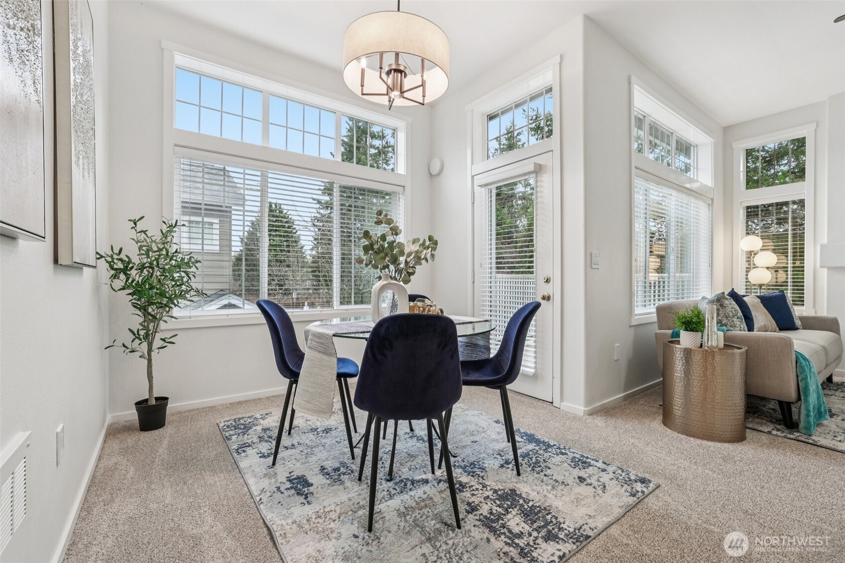 4322 Northeast 5th Court, Unit 105 Renton, WA 98059 - Photo 11 of 36 a view of a dining room with furniture window and wooden floor