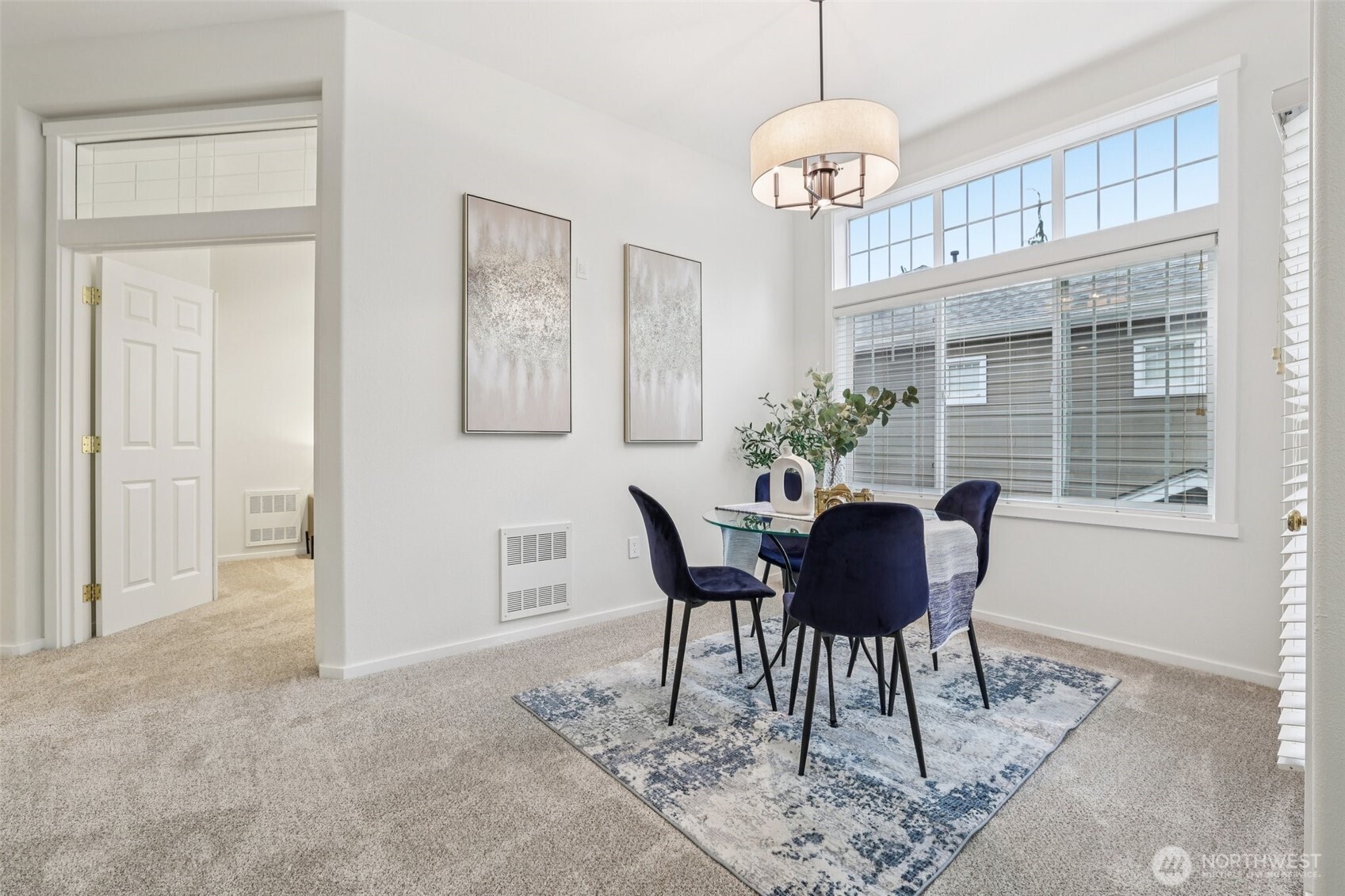 4322 Northeast 5th Court, Unit 105 Renton, WA 98059 - Photo 12 of 36 a view of a dining room with furniture window and wooden floor