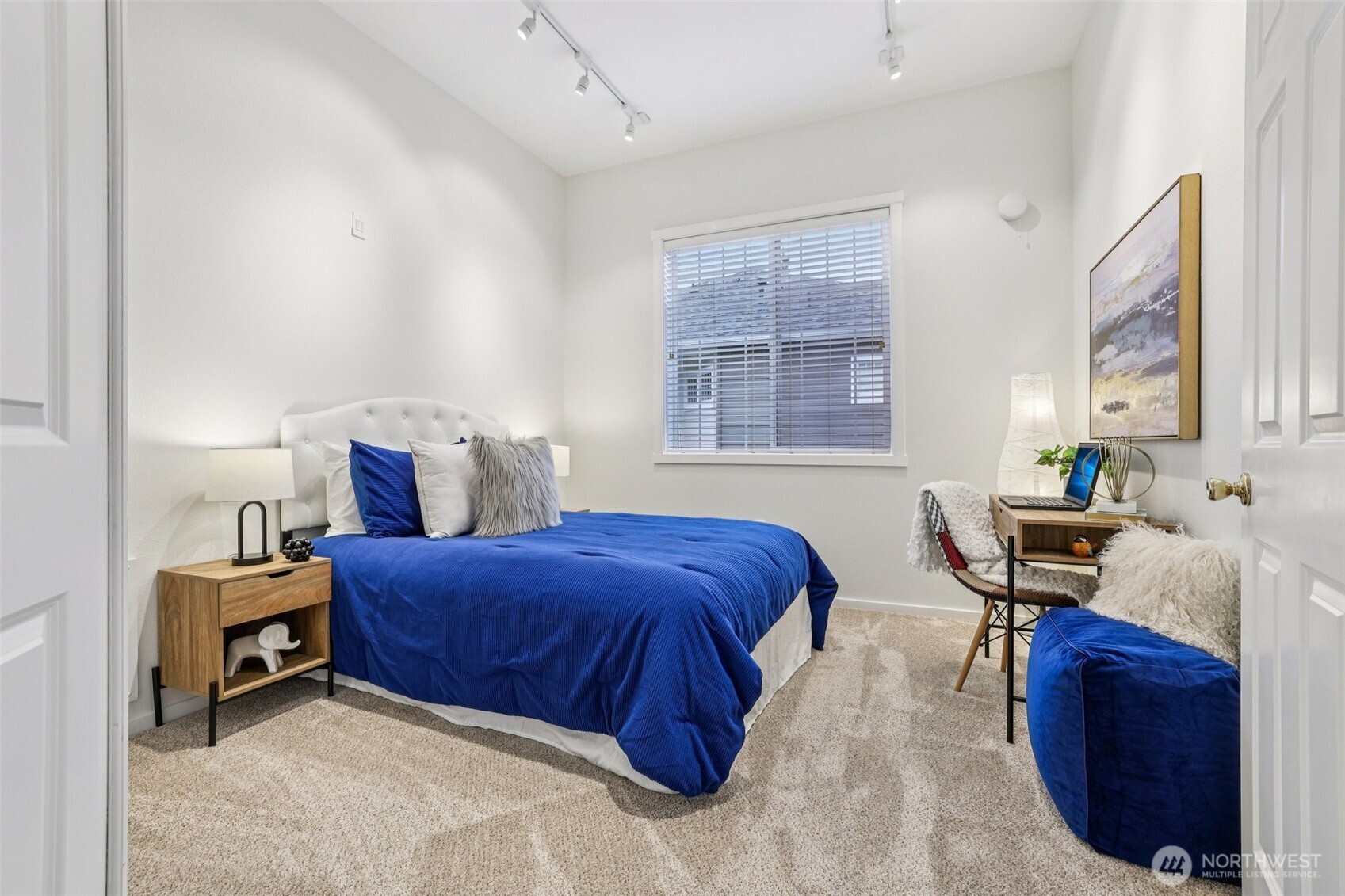 4322 Northeast 5th Court, Unit 105 Renton, WA 98059 - Photo 17 of 36 a bedroom with a bed and a window