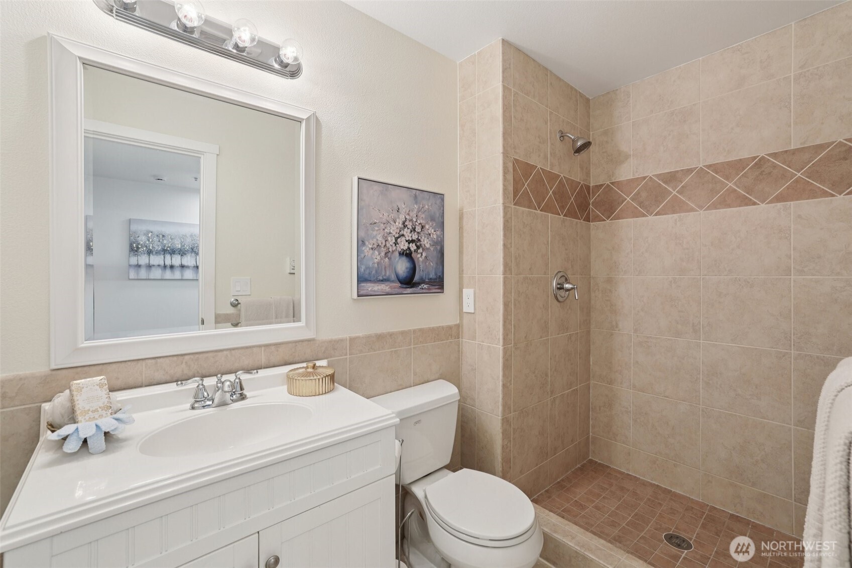 4322 Northeast 5th Court, Unit 105 Renton, WA 98059 - Photo 18 of 36 a bathroom with a sink a toilet and shower