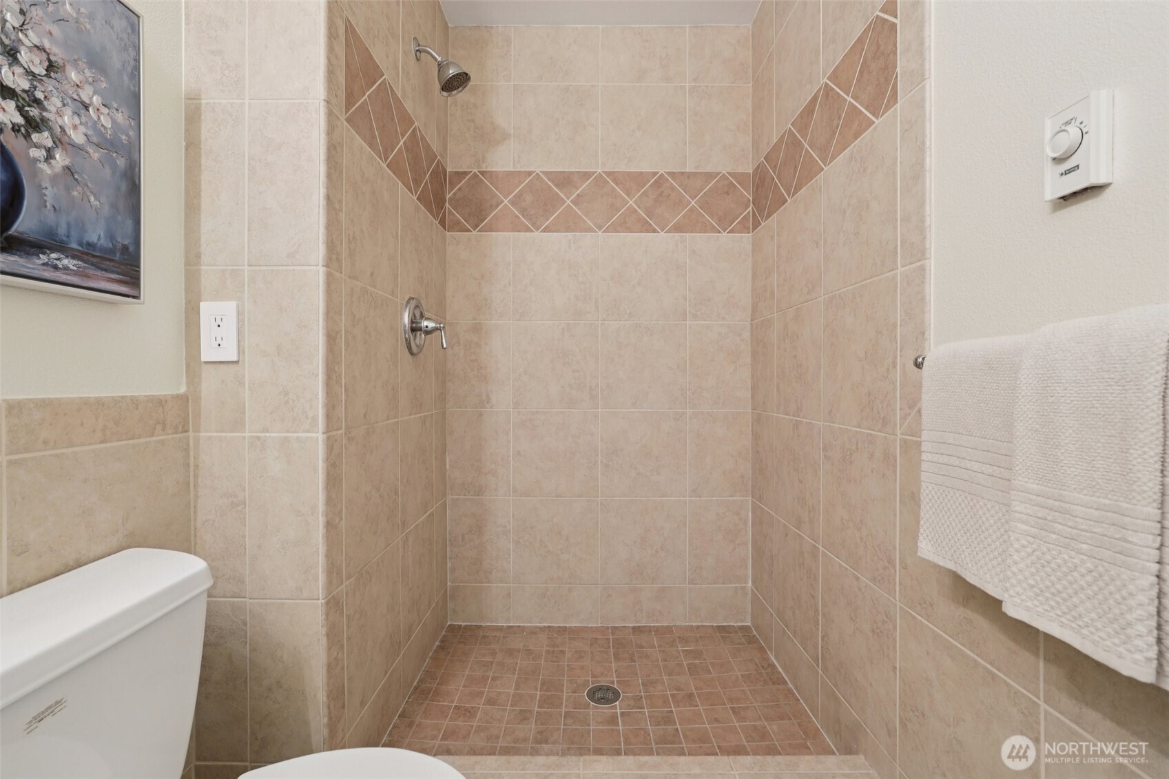 4322 Northeast 5th Court, Unit 105 Renton, WA 98059 - Photo 19 of 36 a bathroom with a shower and a toilet