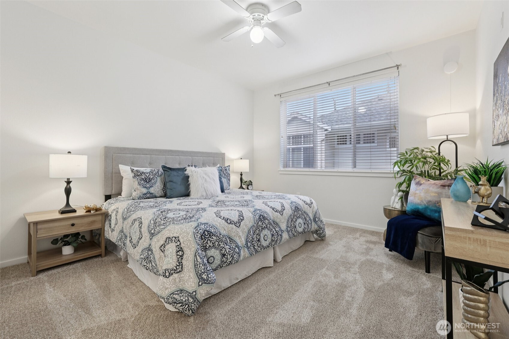 4322 Northeast 5th Court, Unit 105 Renton, WA 98059 - Photo 22 of 36 a bedroom with a bed and a potted plant