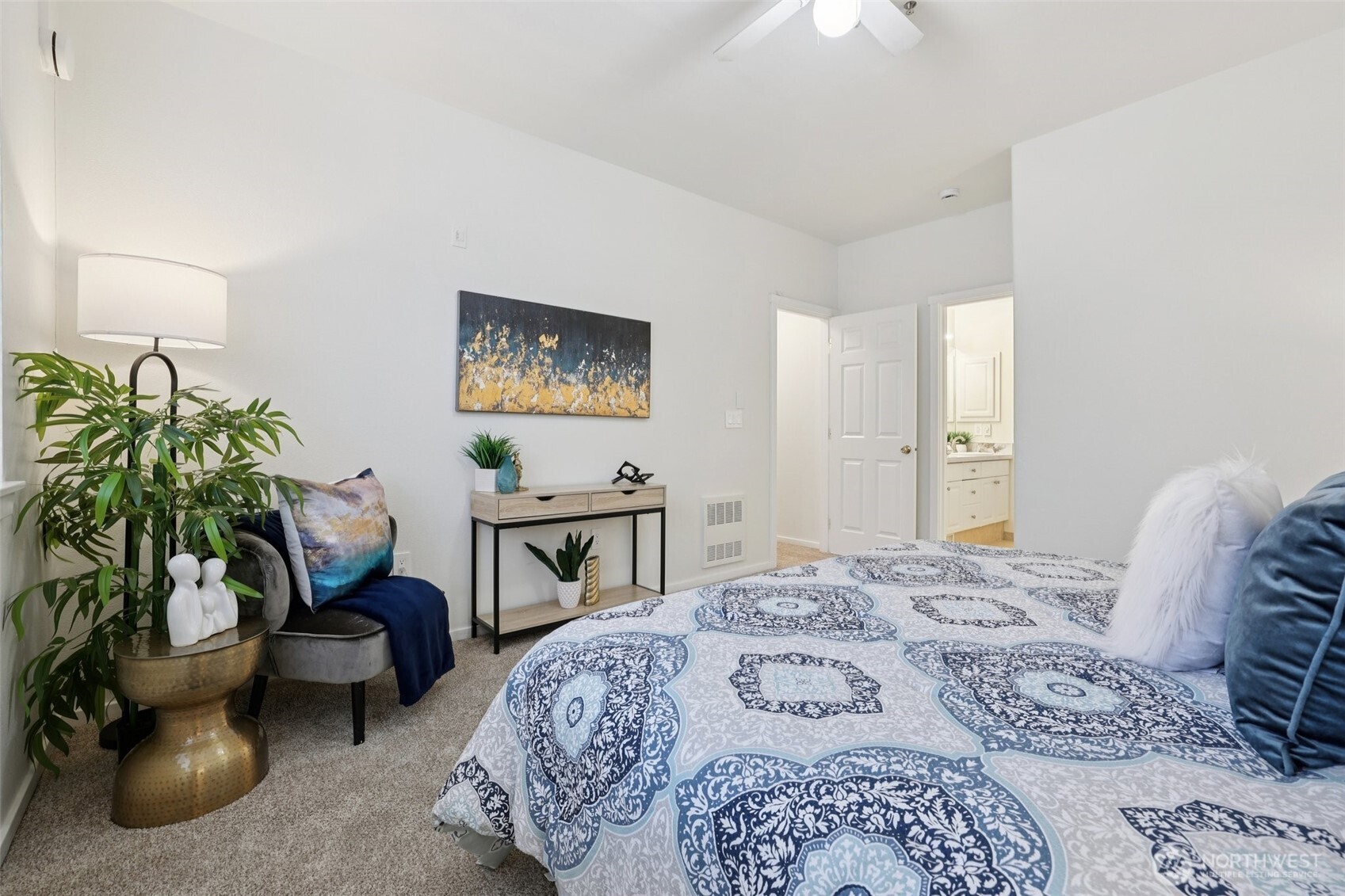 4322 Northeast 5th Court, Unit 105 Renton, WA 98059 - Photo 23 of 36 a bedroom with furniture and a bed