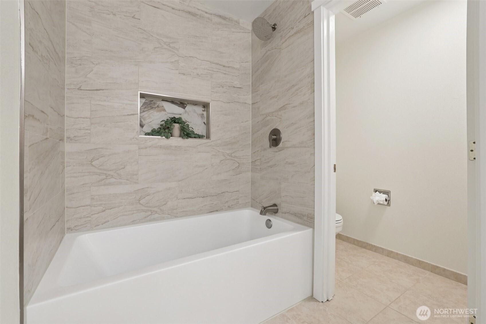 4322 Northeast 5th Court, Unit 105 Renton, WA 98059 - Photo 26 of 36 a bathroom with a bathtub