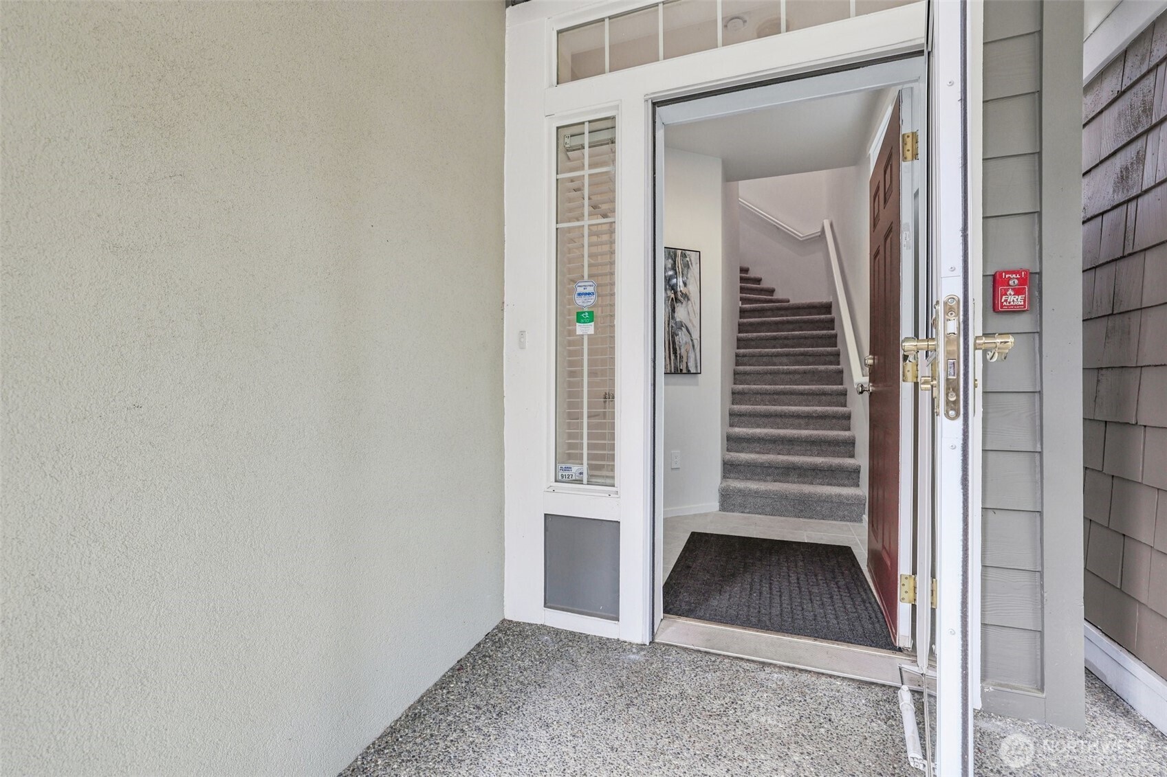 4322 Northeast 5th Court, Unit 105 Renton, WA 98059 - Photo 3 of 36 a view of an entryway with wooden floor