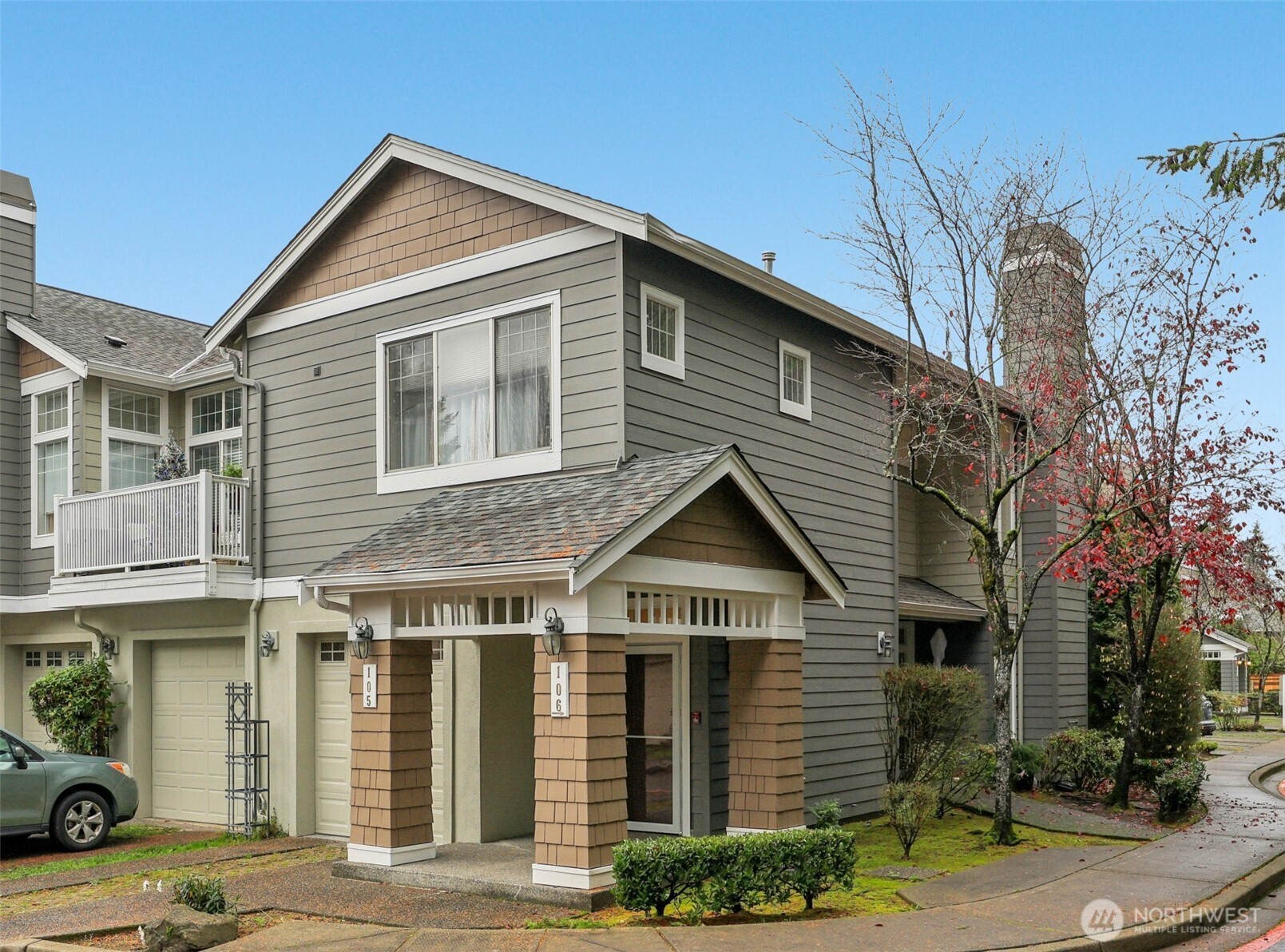 4322 Northeast 5th Court, Unit 105 Renton, WA 98059 - Photo 32 of 36 a front view of a house with a yard