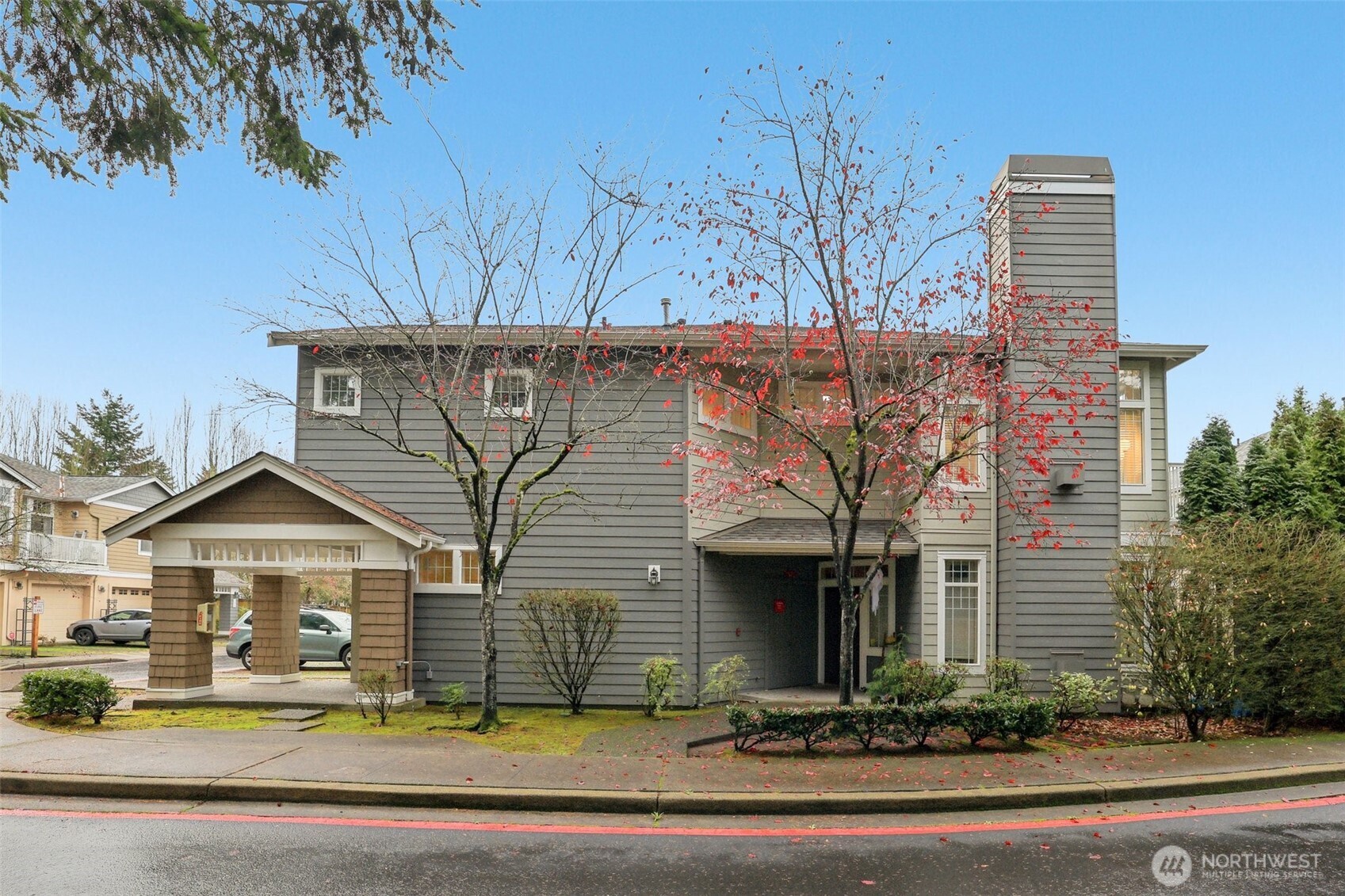 4322 Northeast 5th Court, Unit 105 Renton, WA 98059 - Photo 35 of 36 a front view of a house with a yard
