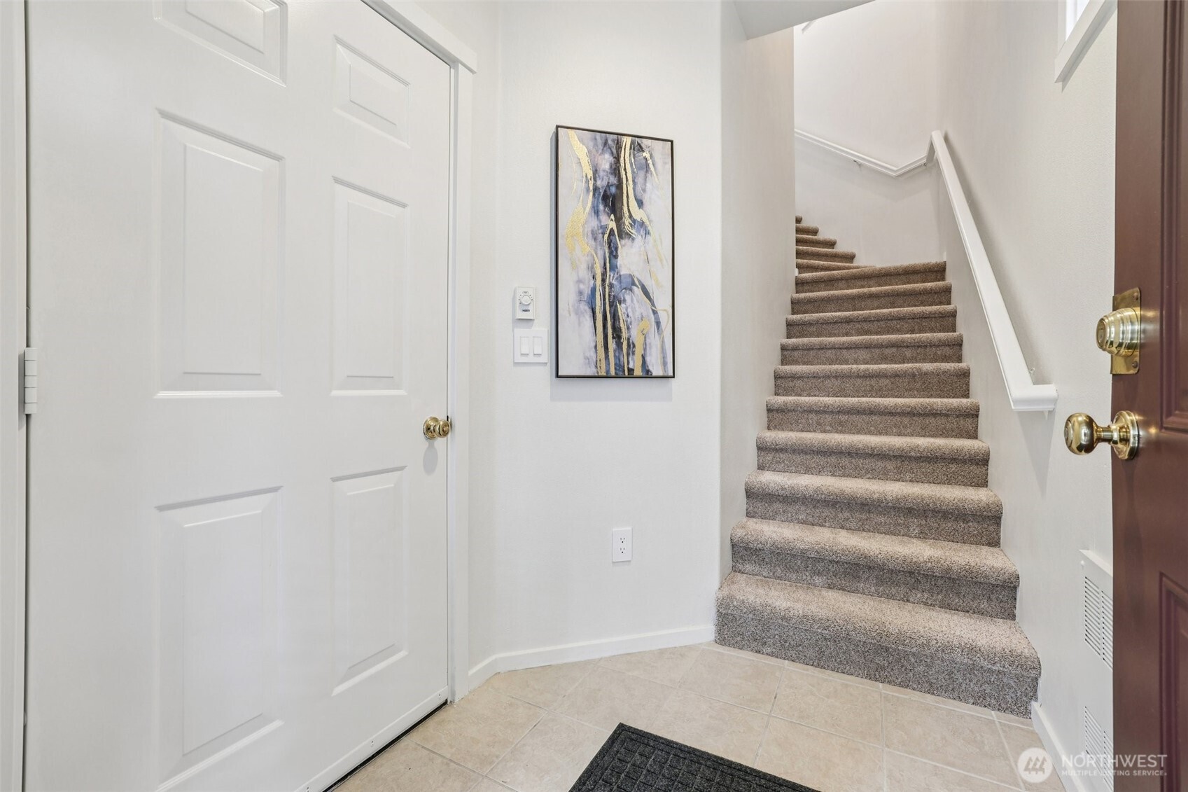 4322 Northeast 5th Court, Unit 105 Renton, WA 98059 - Photo 4 of 36 a view of an entryway with staircase