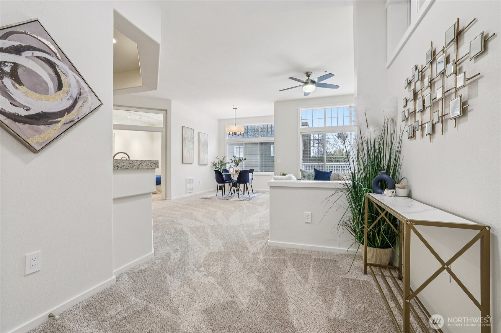 4322 Northeast 5th Court, Unit 105 Renton, WA 98059 - Photo 5 of 36 a view of living room kitchen and a window