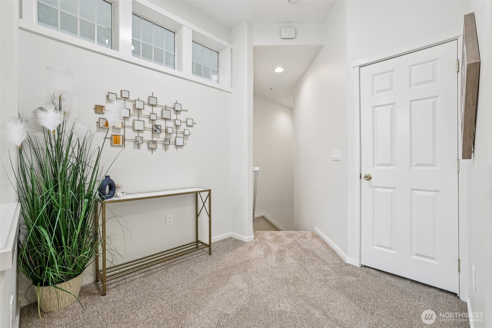 4322 Northeast 5th Court, Unit 105 Renton, WA 98059 - Photo 6 of 36 a view of entryway with wooden floor