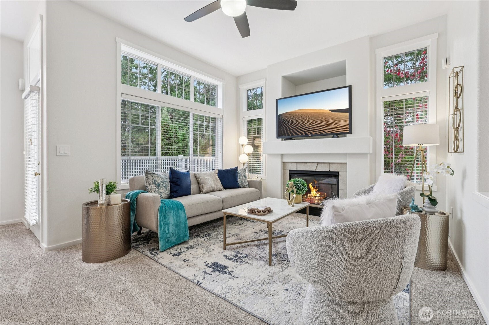 4322 Northeast 5th Court, Unit 105 Renton, WA 98059 - Photo 7 of 36 a living room with furniture a flat screen tv and a fireplace