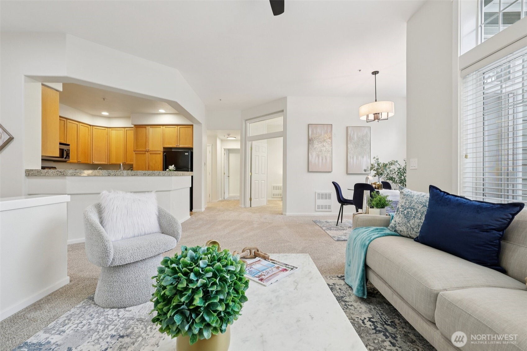 4322 Northeast 5th Court, Unit 105 Renton, WA 98059 - Photo 8 of 36 a living room with furniture and a large window