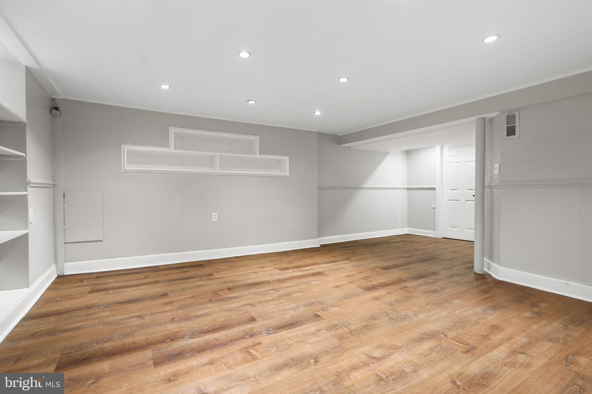 1714 Pin Oak Road Parkville, MD 21234 - Photo 29 of 41 LL Rec Room with LVP, recessed lights & built-ins