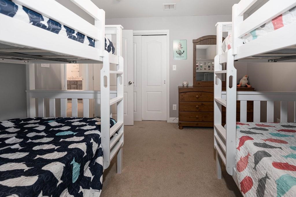 415 East Heather Road, Unit 106 Wildwood Crest, NJ 08260 - Photo 21 of 41 a view of a bedroom with a bed
