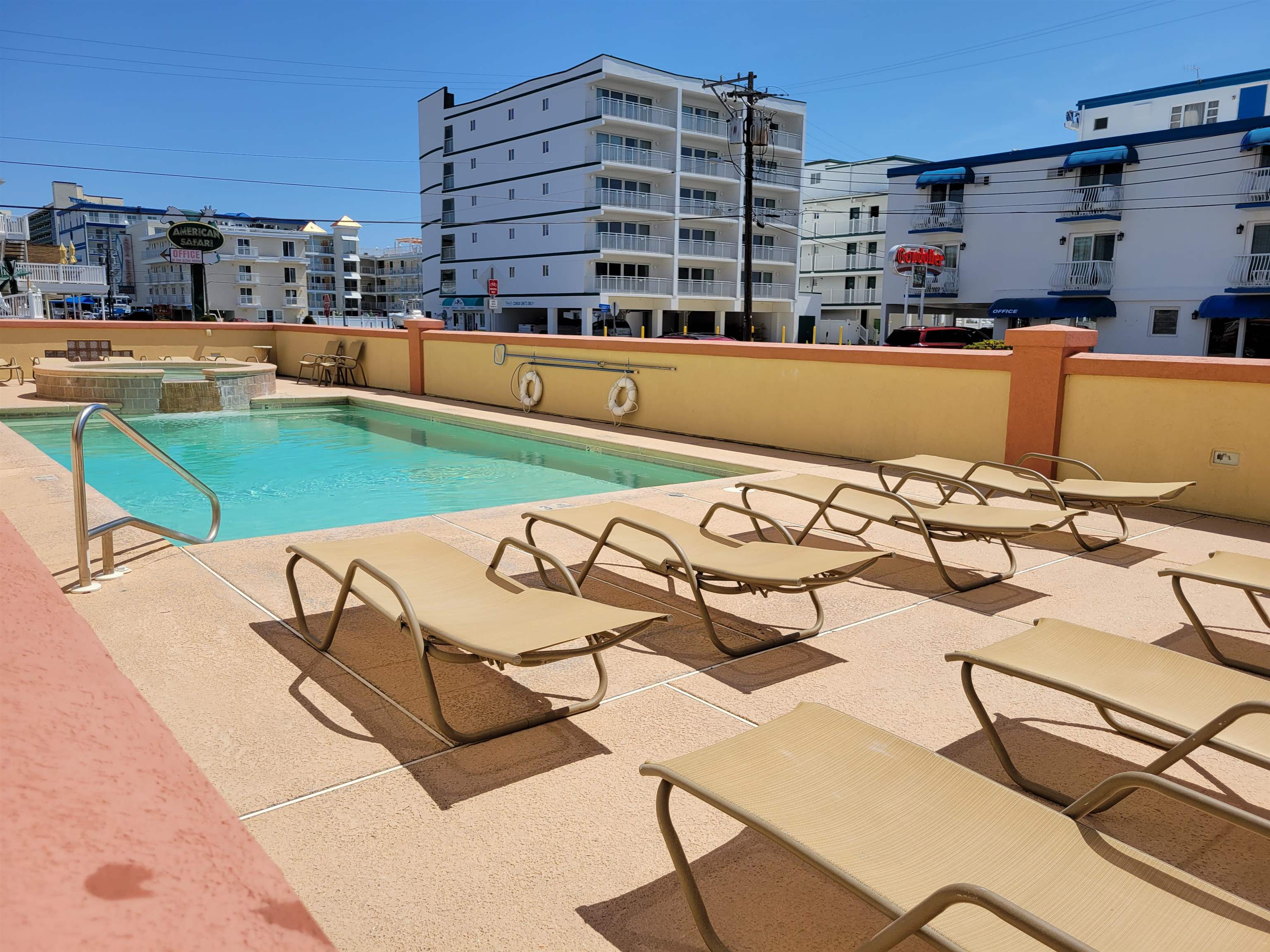 415 East Heather Road, Unit 106 Wildwood Crest, NJ 08260 - Photo 25 of 41 a view of a swimming pool with a lounge chairs