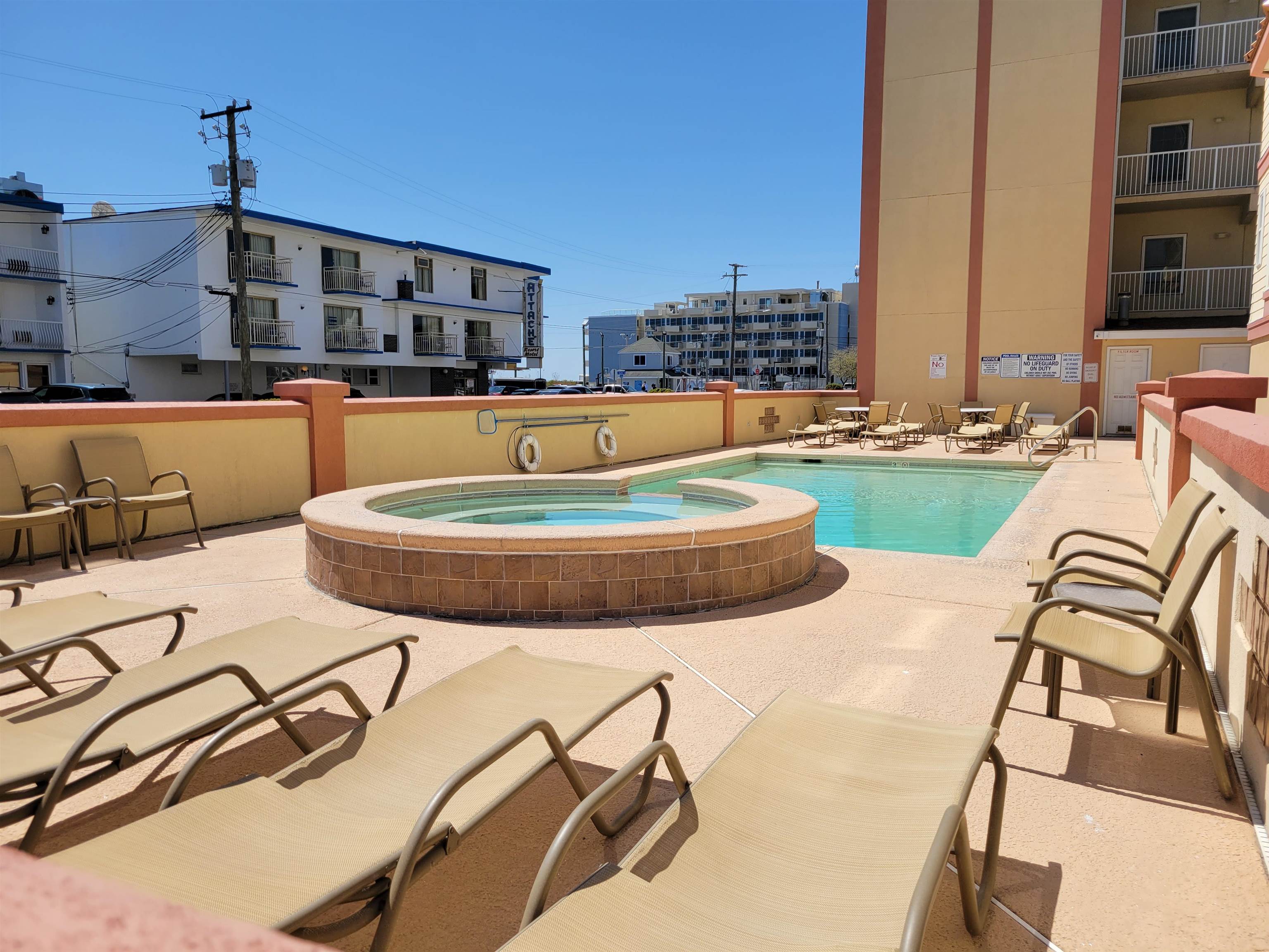 415 East Heather Road, Unit 106 Wildwood Crest, NJ 08260 - Photo 28 of 41 a view of a swimming pool with outdoor seating