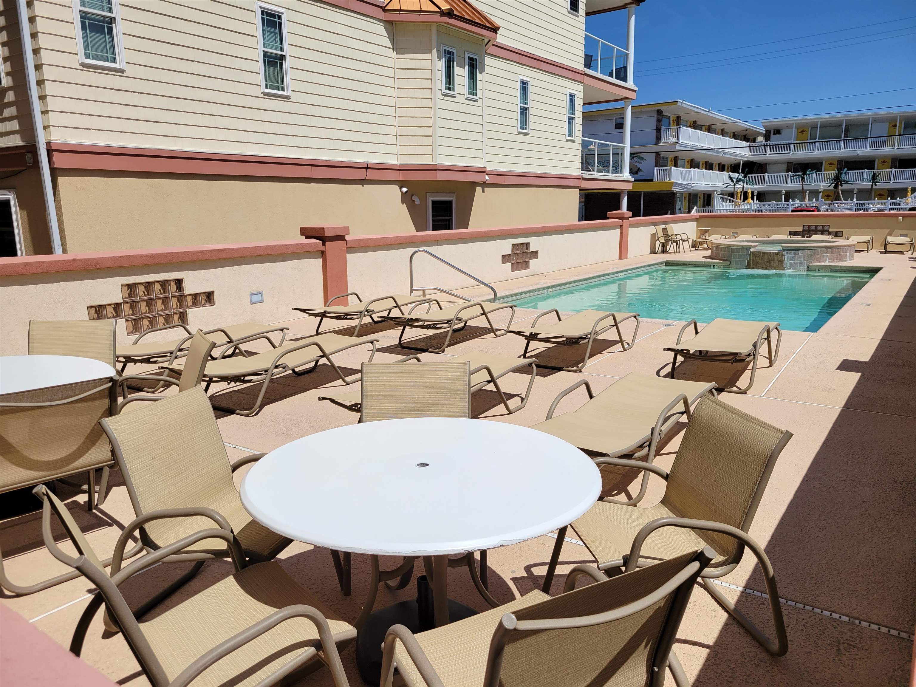 415 East Heather Road, Unit 106 Wildwood Crest, NJ 08260 - Photo 29 of 41 a view of a patio with table and chairs