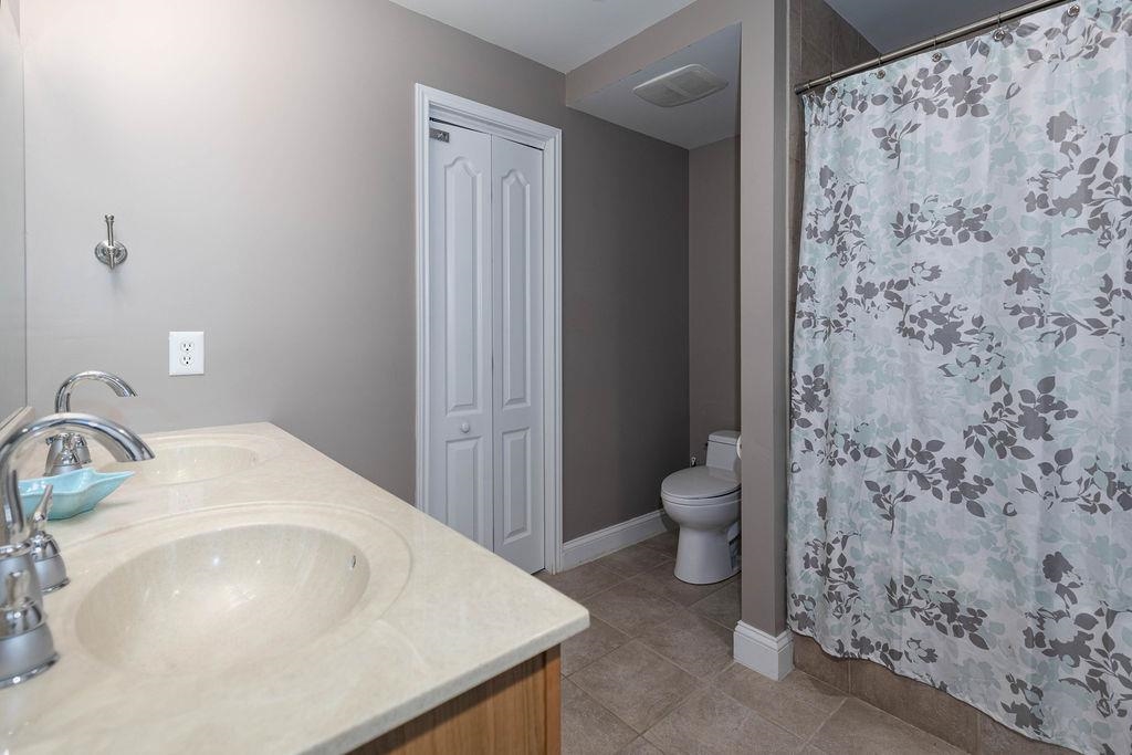 415 East Heather Road, Unit 106 Wildwood Crest, NJ 08260 - Photo 31 of 41 a bathroom with a sink toilet and shower
