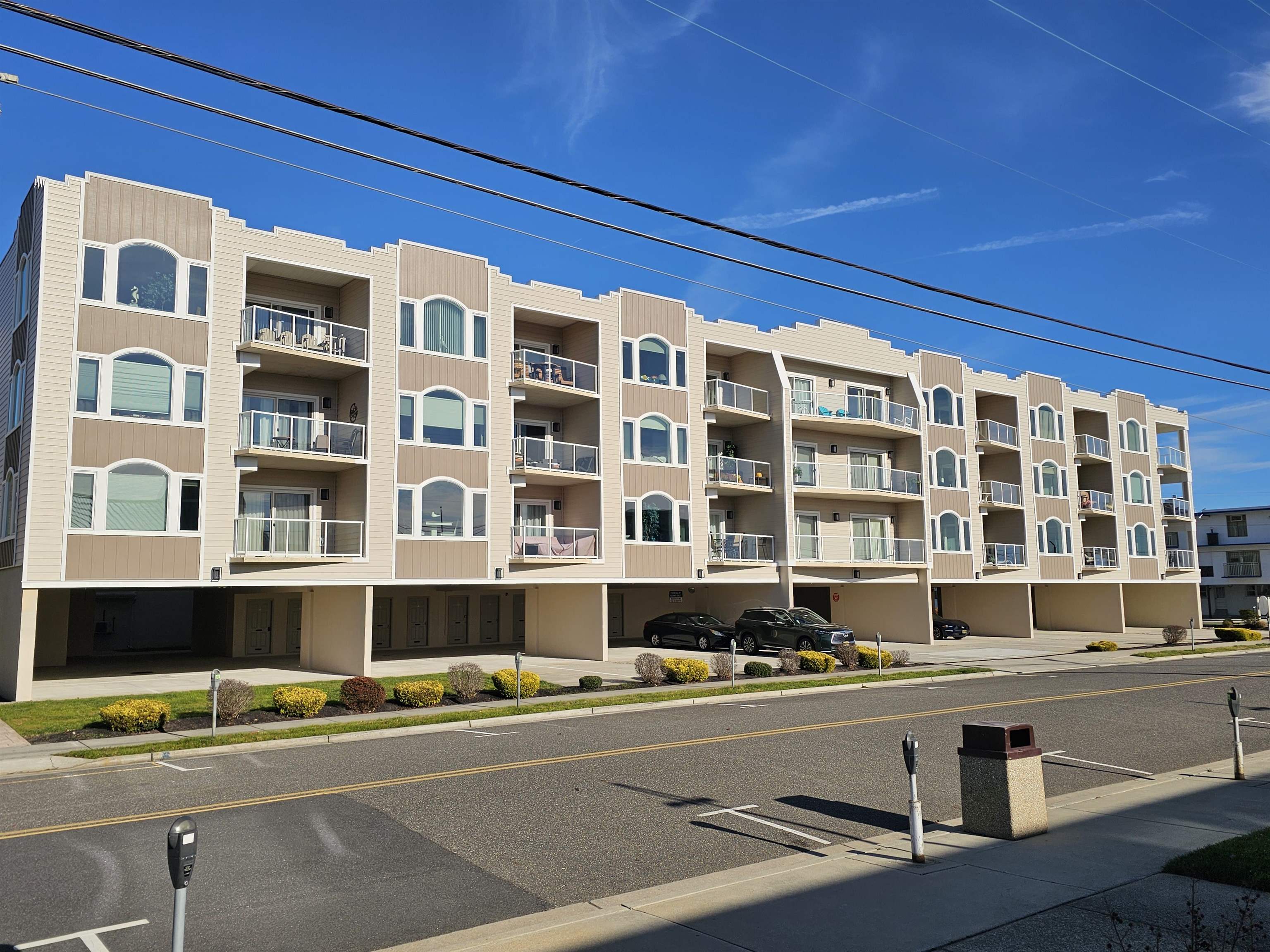 415 East Heather Road, Unit 106 Wildwood Crest, NJ 08260 - Photo 39 of 41 a front view of a building with a lot of windows