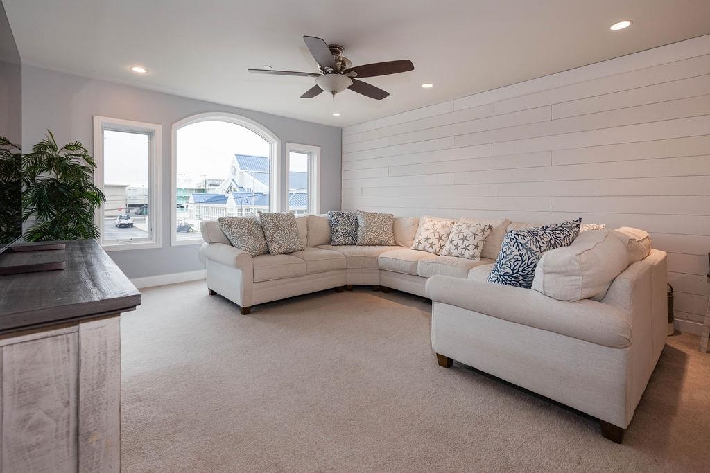 415 East Heather Road, Unit 106 Wildwood Crest, NJ 08260 - Photo 9 of 41 a living room with furniture and a large window