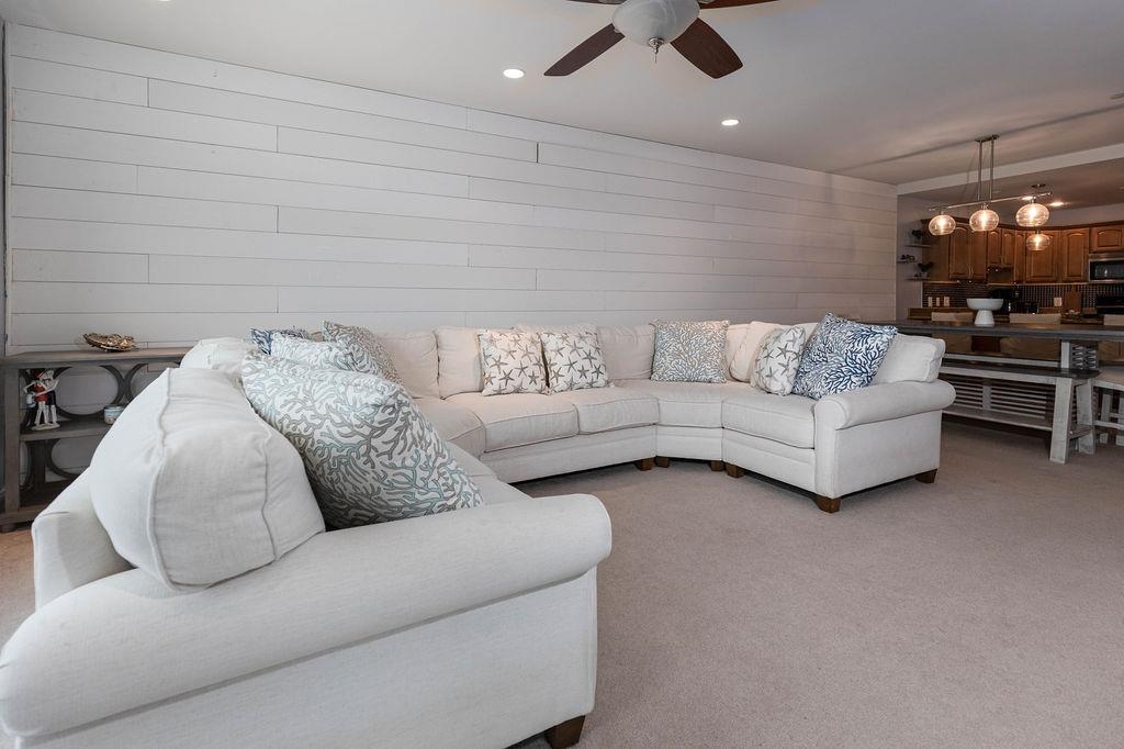 415 East Heather Road, Unit 106 Wildwood Crest, NJ 08260 - Photo 10 of 41 a living room with furniture and a flat screen tv