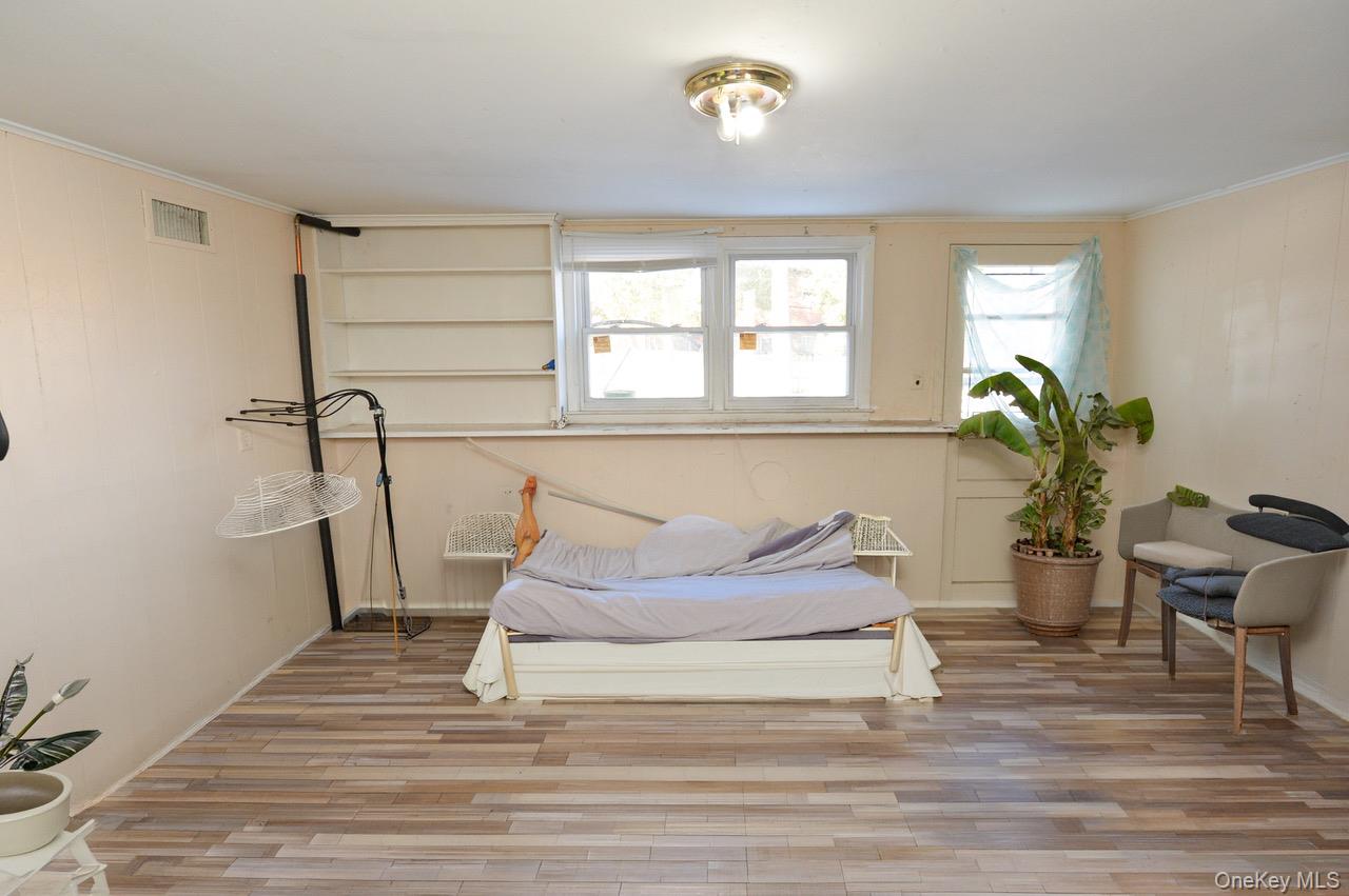 7 South Oak Street Spring Valley, NY 10977 - Photo 14 of 24 a living room with furniture and wooden floor