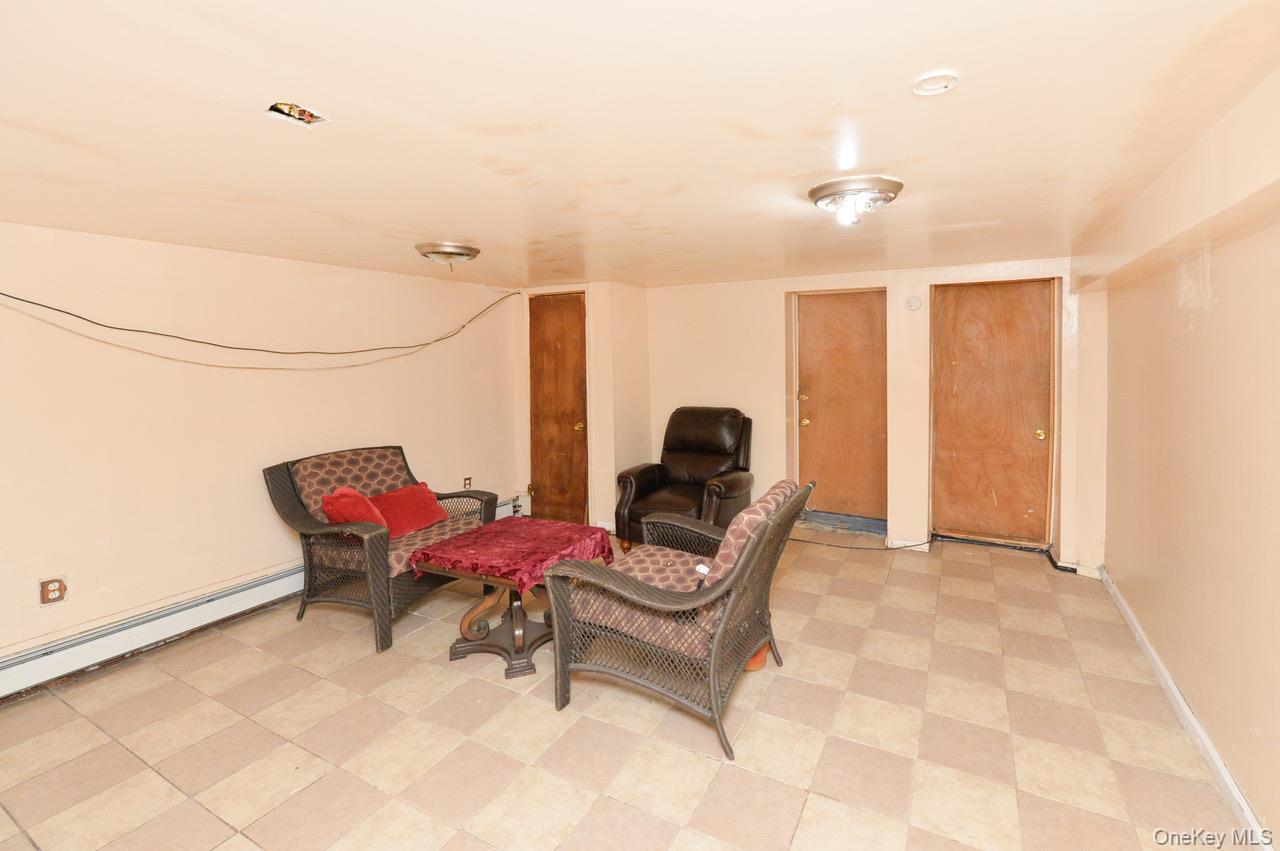 7 South Oak Street Spring Valley, NY 10977 - Photo 15 of 24 a living room with furniture and a window